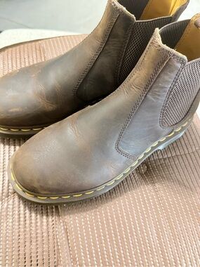 Dr. Martens Brown Chelsea Boots featuring yellow stitching.